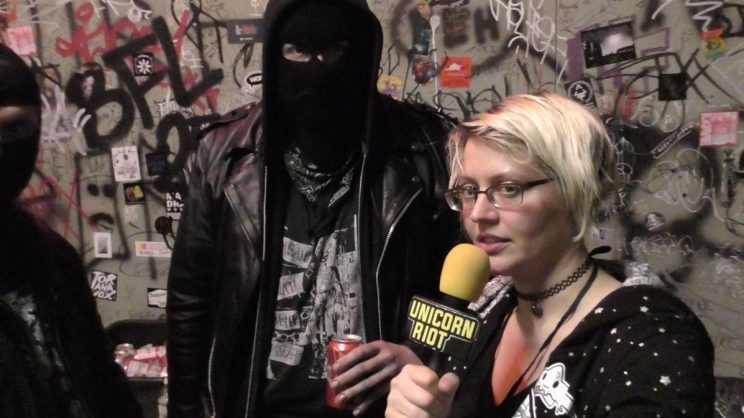 Unicorn Riot journalist Jenn interviewing the band Neckbeard Deathcamp at Black Flags Over Brooklyn Anti-Fascist Metal Festival
