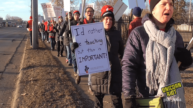 Saint Paul, Minnesota Educators Union on strike the morning of March 10 outside Washington Technology Magnet School in Minnesota. One teacher holds a sign, "I'd rather be teaching but this is IMPORTANT!"