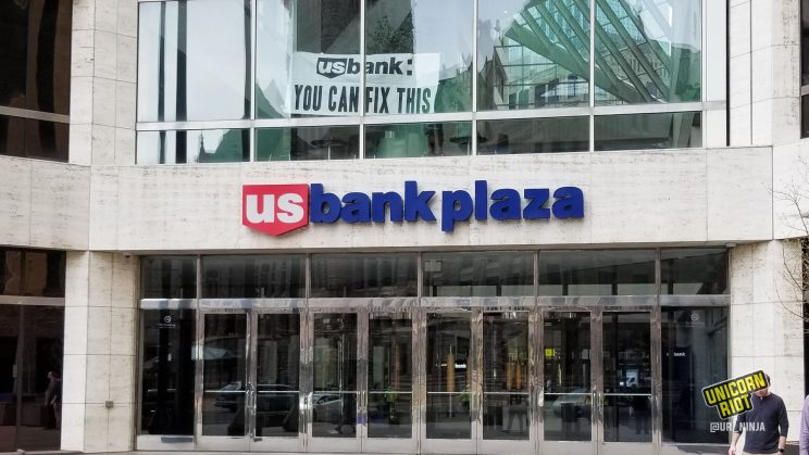 Banner reading "U.S. Bank: You Can Fix This" was unfurled at U.S. Bank Plaza 