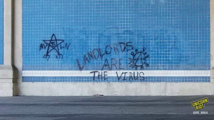 Graffiti reads "Landlords are the virus"