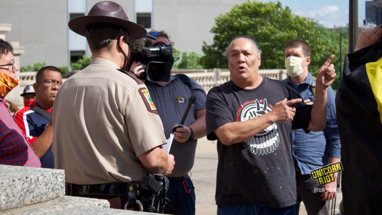 Mike Forcia speaks with State Trooper at Minnesota's State Capitol Complex