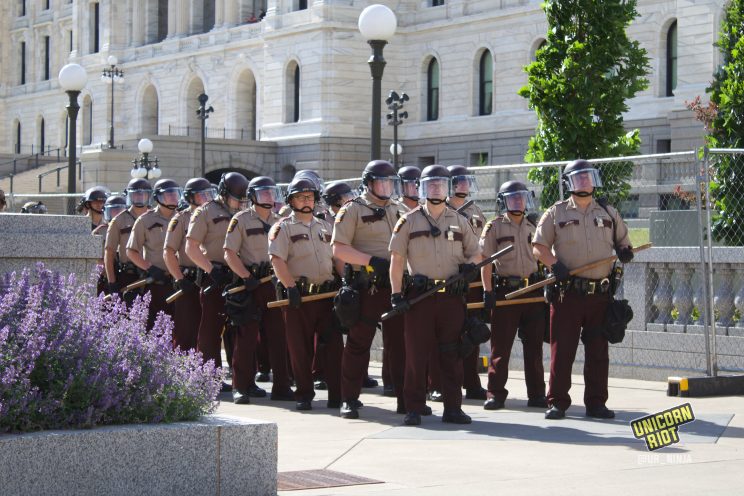 State Troopers line up after Columbus statue taken down