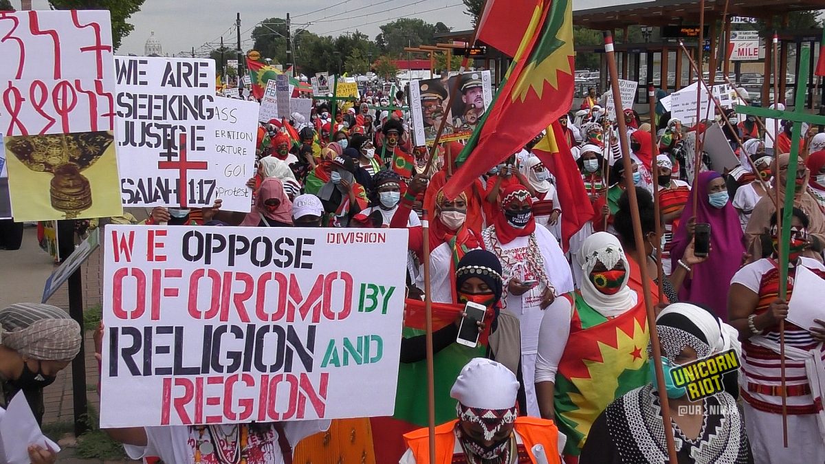 Sign reads “We oppose division of Oromo by religion and region” at the women’s march on August 7, 2020 in Saint Paul, MN