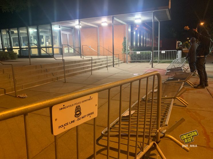 metal barricades were knocked down outside of the 5th precinct