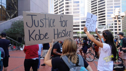 Justice for Kobe Heisler sign held up during demo