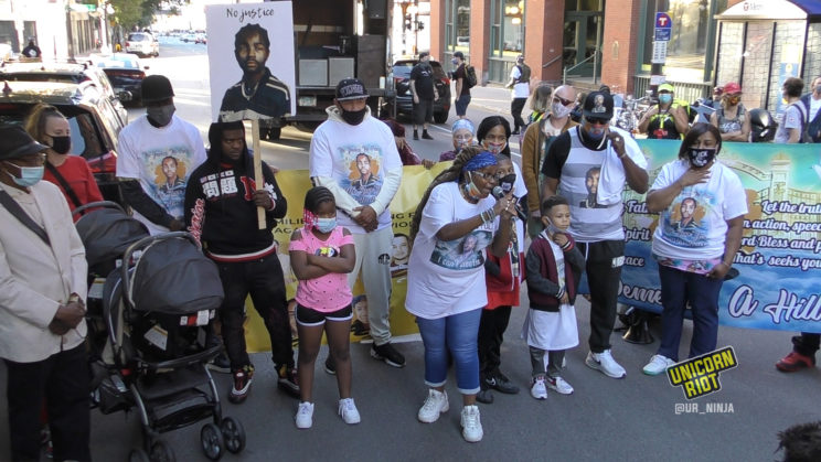 Marilyn Hill speaks with her family, seeking justice for her son Demetrius Hill, who was killed by police in 1997