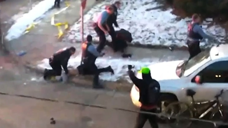 minneapolis police kneeling on a person's neck while they hang off the curb with their face into the concrete