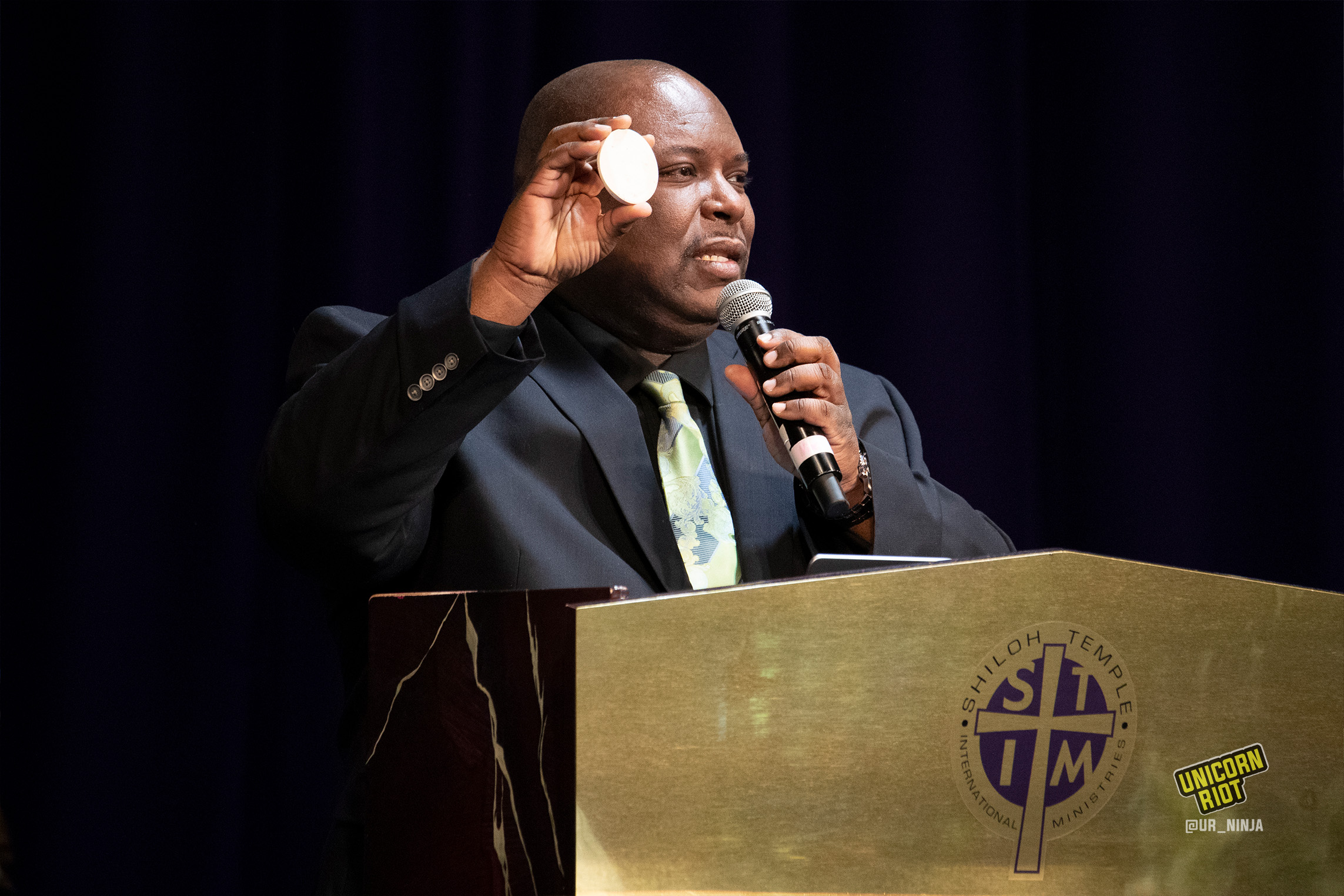 February 17, 2022, Minneapolis, MN: Holding a circular object, Andrew Tyler, the uncle of Amir Locke compares the object to the size of the bullet holes in Amir.