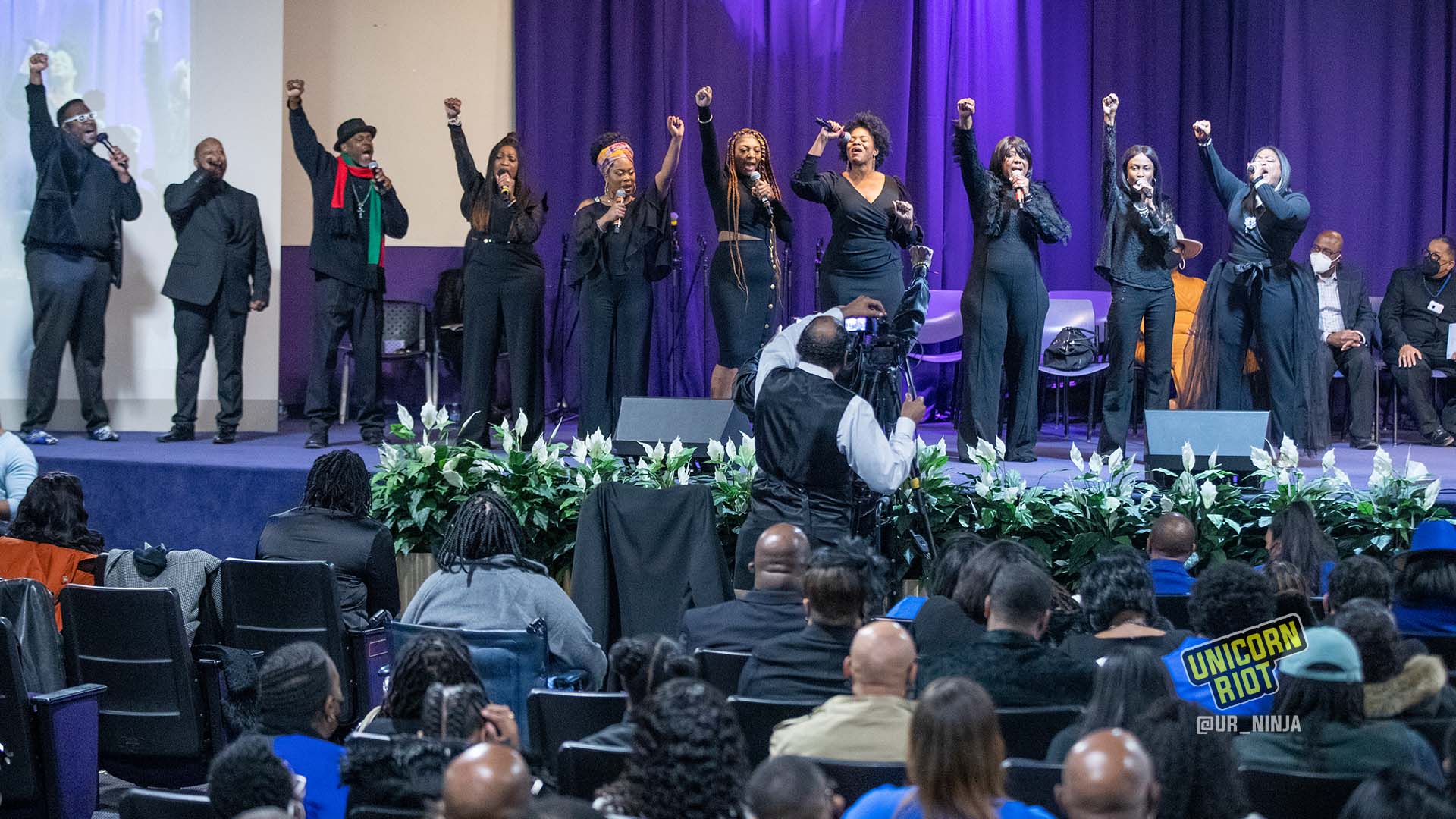 February 17, 2022, Minneapolis, MN: Raising their fists in the air, The Sounds of Blackness perform the song "Black Lives Matter."