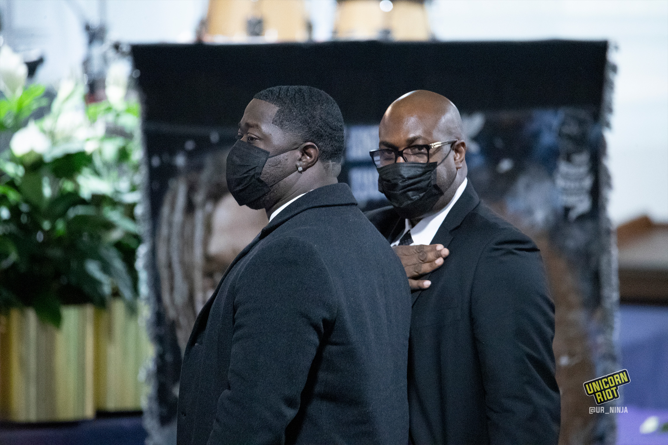 February 17, 2022, Minneapolis, MN: Philonise Floyd, the brother of George Floyd (right) and Brandon Williams, George Floyd's nephew stand up when recognized by the speaker at Amir Lockes funeral.