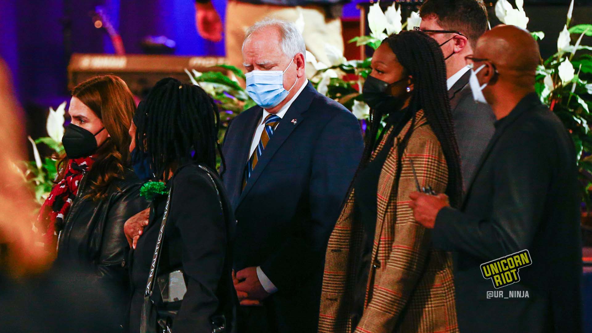 February 17, 2022, Minneapolis, MN: Minnesota Gov. Tim Walz walks towards the casket of Amir Locke before the start of the funeral at Shiloh Temple.