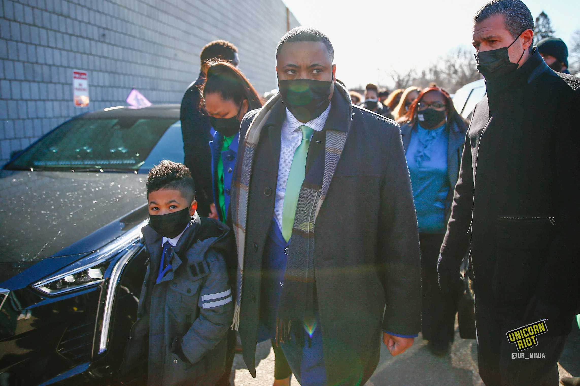 February 17, 2022, Minneapolis, MN: Andre Locke, the father of Amir Locke walks into Shiloh Temple with members of his family before the start of the funeral.