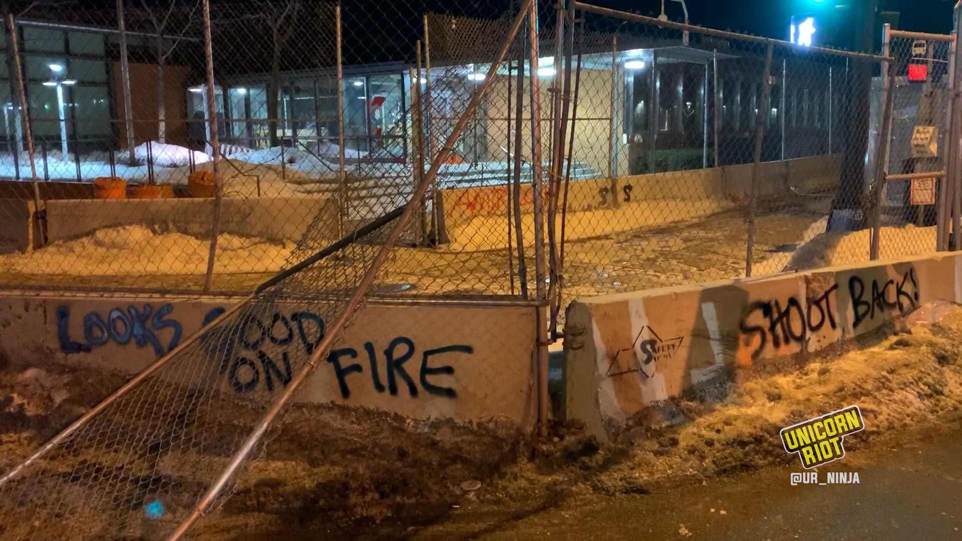 First layer of fencing around MPD's 5th Precinct was halfway torn down by protesters during February 11 march for Amir Locke