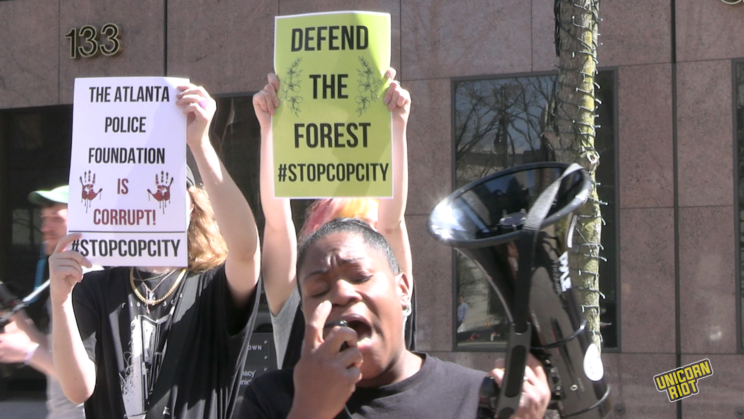 APF_is_Corrupt_Defend_The_Forest_protest_signs - UNICORN RIOT