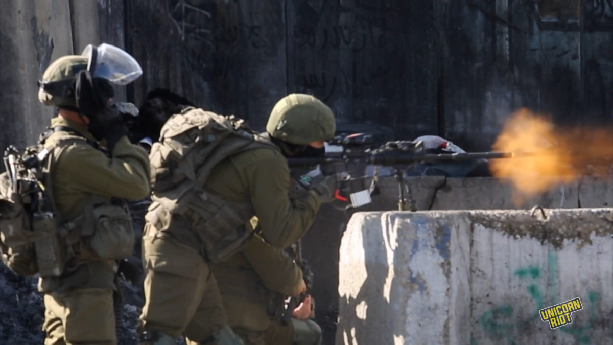 Israeli soldiers shoot live bullets at Palestinian protesters demanding the body of Nasser Abu Hamid be given to his family after he died in Israeli custody