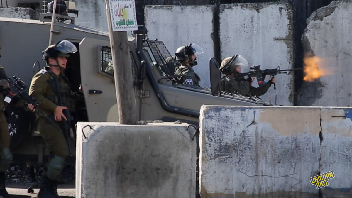 Israeli soldiers shoot live bullets at Palestinian protesters demanding the body of Nasser Abu Hamid be given to his family after he died in Israeli custody