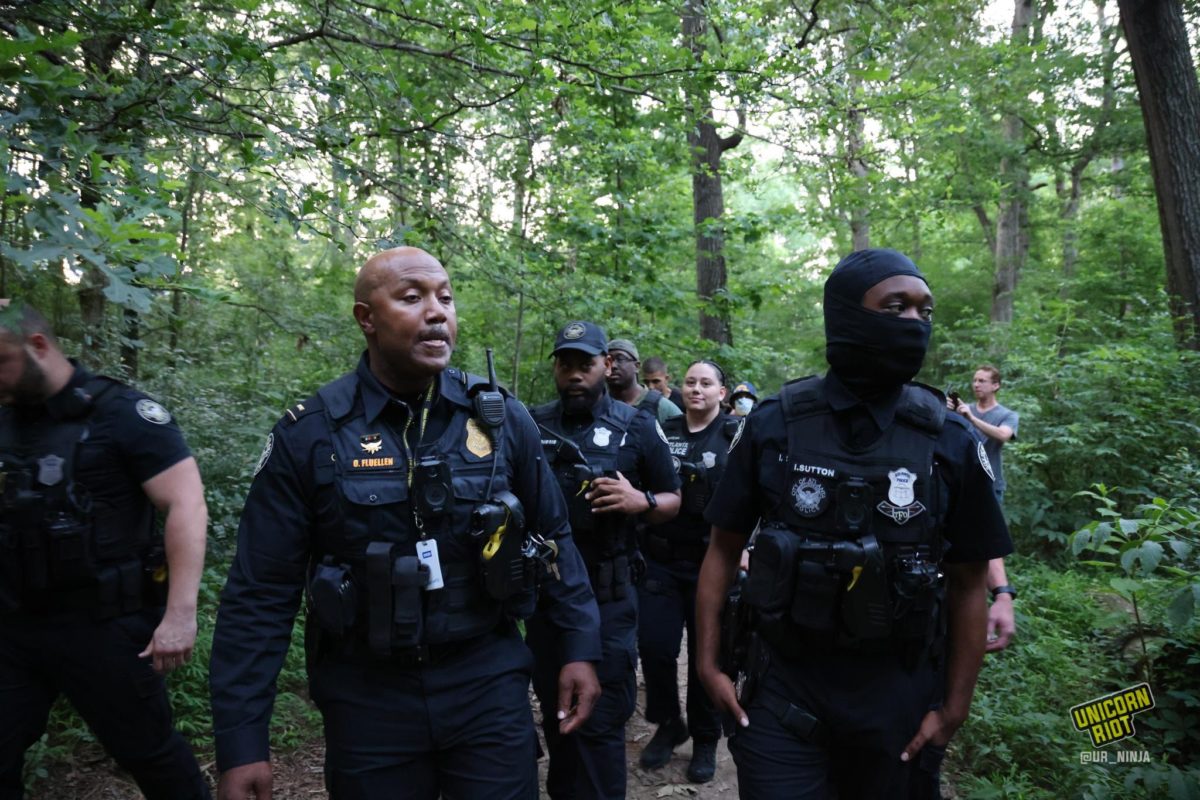 Atlanta Police officers in tactical vests sweep through the park as the vigil for Manuel ‘Tortuguita’ Terán was set to begin at 8:30 p.m.
