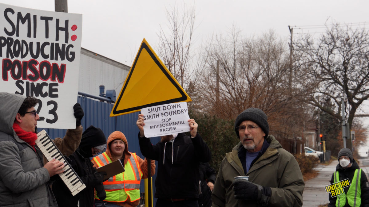 Former EPA risk assessor Doug Gurian-Sherman (right) standing with the Smith Foundry protest